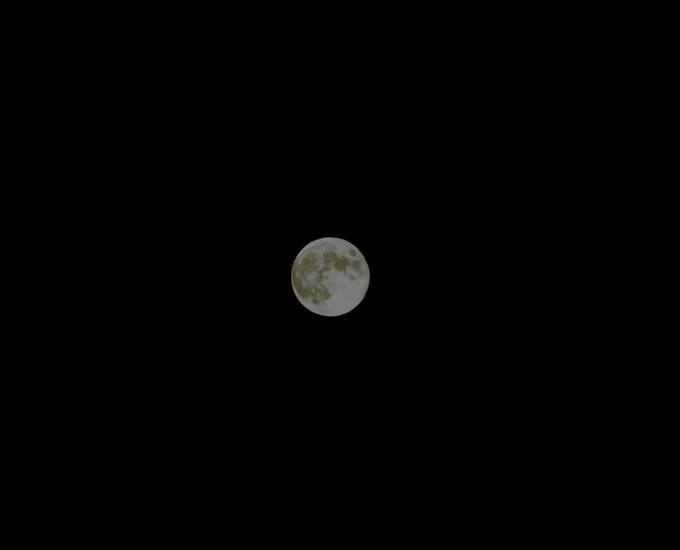 The full Hunter's Moon reaching peak fullness over Kamloops. 