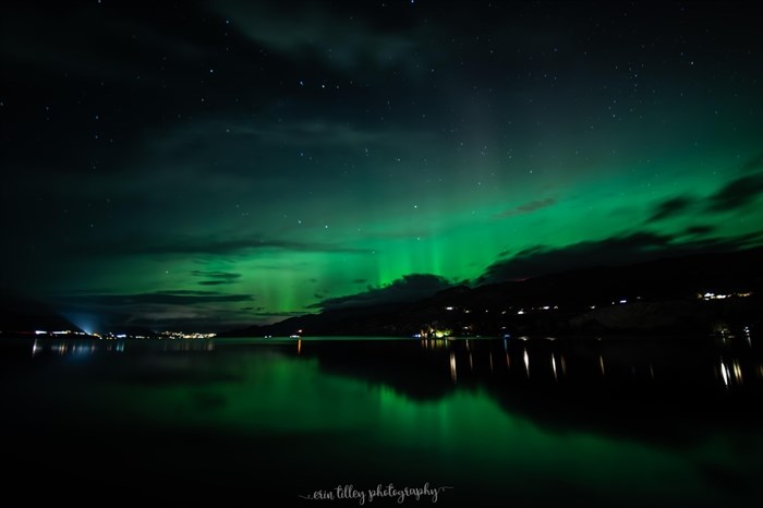 Northern lights are seen in the sky and reflected on the Okanagan lake in Penticton. 