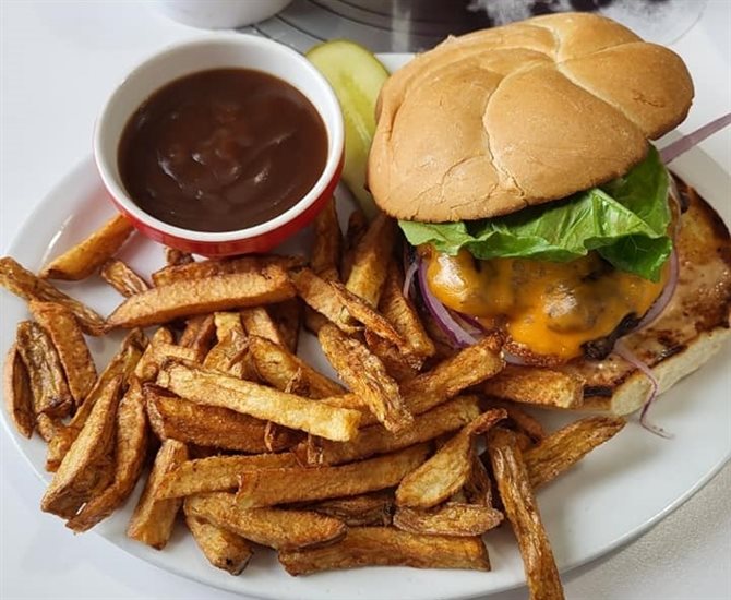 The Route 97 Burger is a 6-ounce homemade burger with meat sourced from local farms, available at Route 97 Diner in Westwold. 