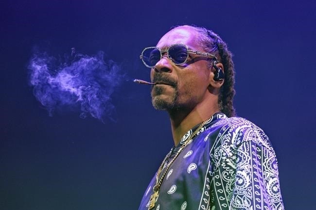 FILE - Rapper Snoop Dogg performs during a concert at Lanxess Arena, Thursday, Sept. 21, 2023, in Cologne, Germany. Asking for privacy, hip-hop legend and longtime marijuana enthusiast Snoop Dogg says he's going to stop smoking — though he didn't specify exactly what that might mean. "After much consideration and conversation with my family, I've decided to give up smoke," Snoop wrote in a message shared on Instagram and X, the platform formerly known as Twitter, on Thursday, Nov. 16.