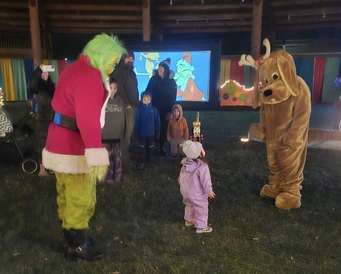 Characters from Who-Ville talk to a little girl at an annual Christmas interactive display in Kamloops.  