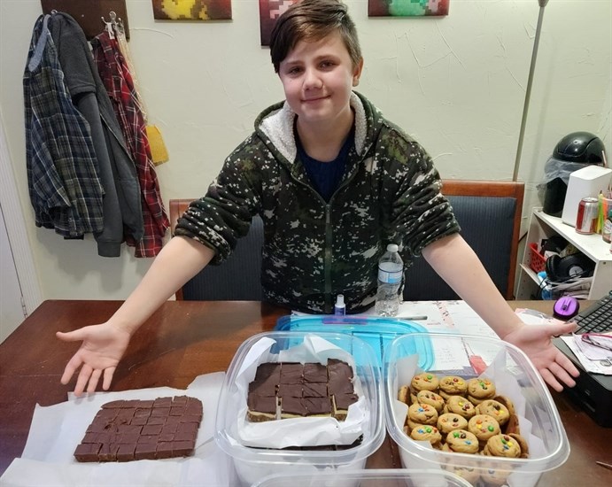 Evan Easterbrook, 12, shows off some of the goodies he's baking for his Kamloops business he runs with his dad. 