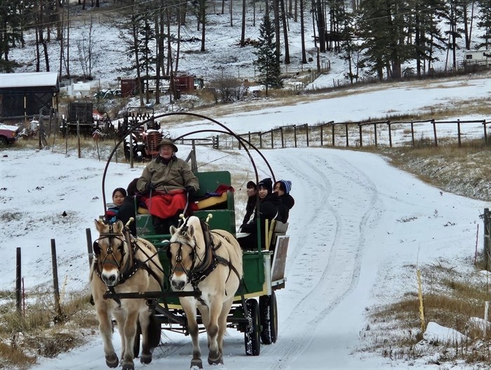 Pritchard resident Ellen Hockley takes drives her horse drawn sleigh full of friends through the snow.