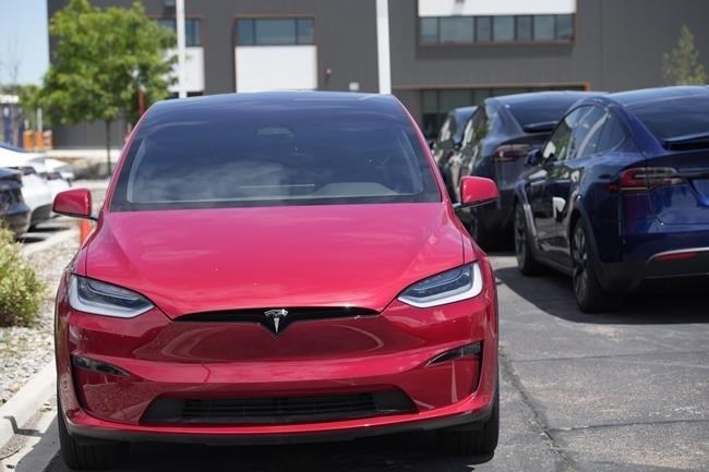File - An unsold 2023 Model X sports-utility vehicle sits at a Tesla dealership June 18, 2023, in Littleton, Colo. Tesla is recalling more than 2 million vehicles across its model lineup to fix a defective system that's supposed to ensure drivers are paying attention when they use Autopilot.