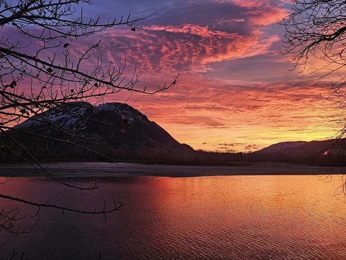 An early morning sunrise is reflected on the Thompson river in Kamloops. 