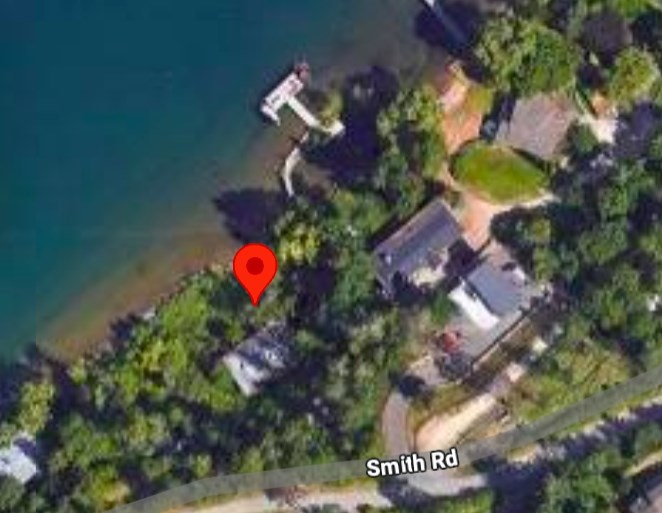 The owners of the property marked by the red arrow and the one to the right of it ended up in court fighting over a small piece of a retaining wall.
