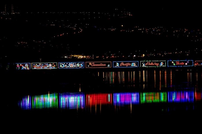 The CP Holiday Train, reflection and Kamloops city lights are captured in this photo. 