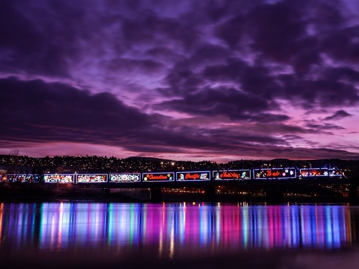 The Holiday Train is seen reflected in the Thompson River in Kamloops. 