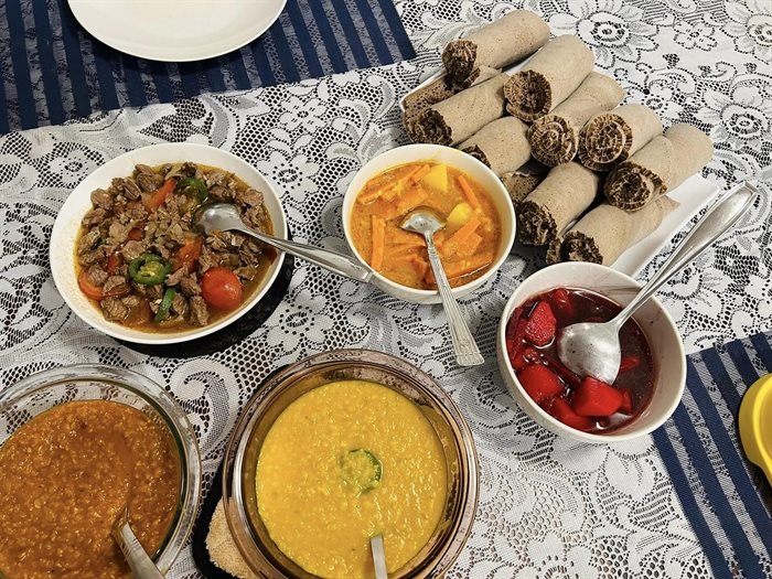 This homemade traditional Ethiopian food with rolls of injera flat bread to serve it on was made by Vernon resident Azeb Gemechu. 