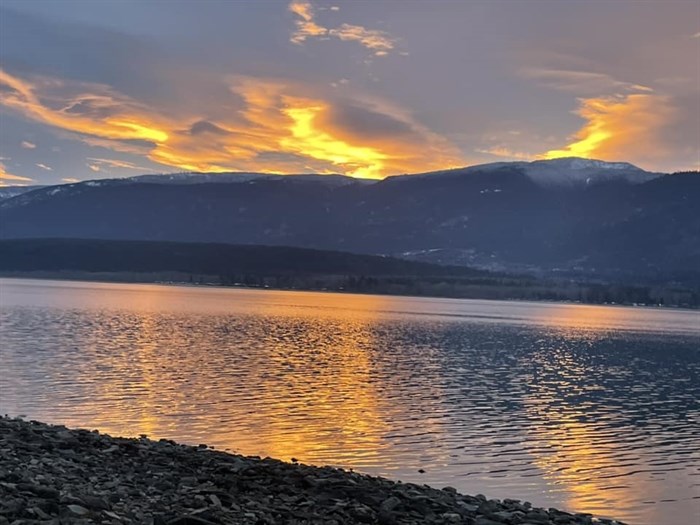 The sunset is seen reflected on Shuswap Lake in Salmon Arm. 