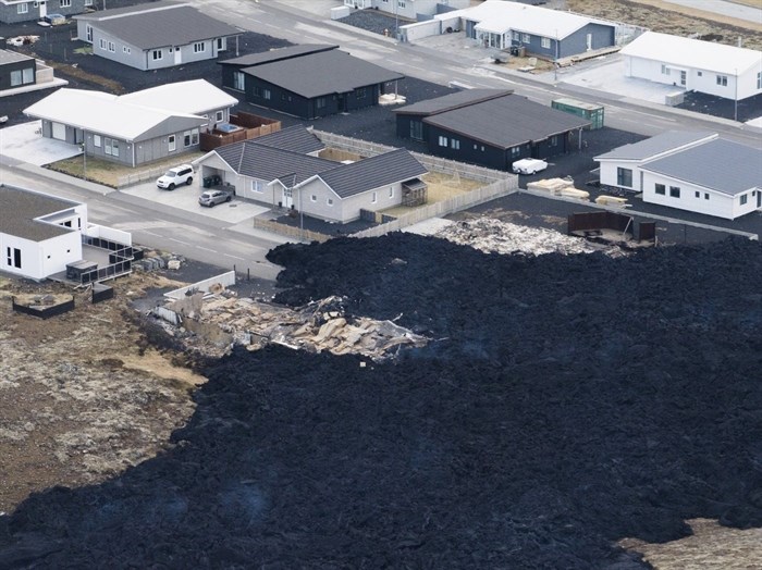 An areal view of the lava flow front in the town of Grindavik, Iceland, Monday, Jan. 15, 2024. Iceland's president says the country is battling 