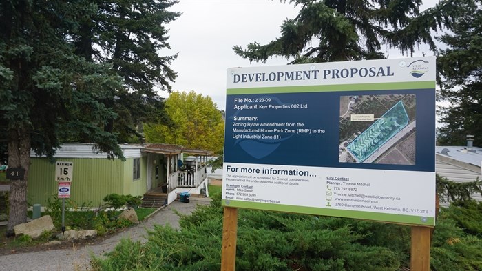A sign for a redevelopment proposal outside of the Shady Acres manufactured community in West Kelowna. 