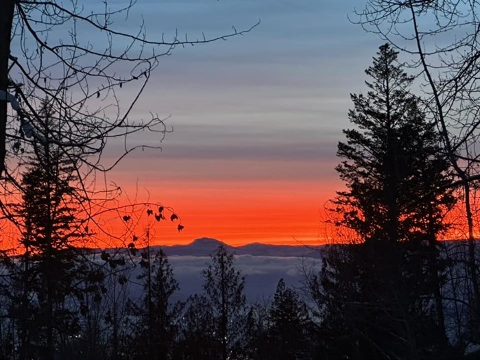 The orange setting sun photographer enroute to SilverStar Mountain Resort. 