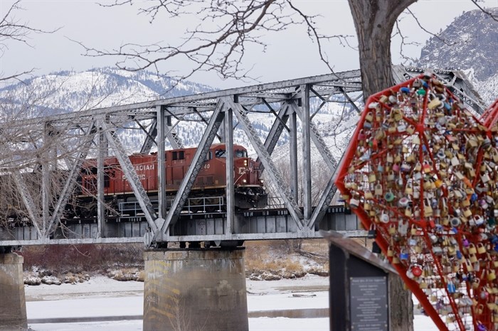Canadian Pacific Rail train crosses a bridge in icy temperatures in Kamloops. 
