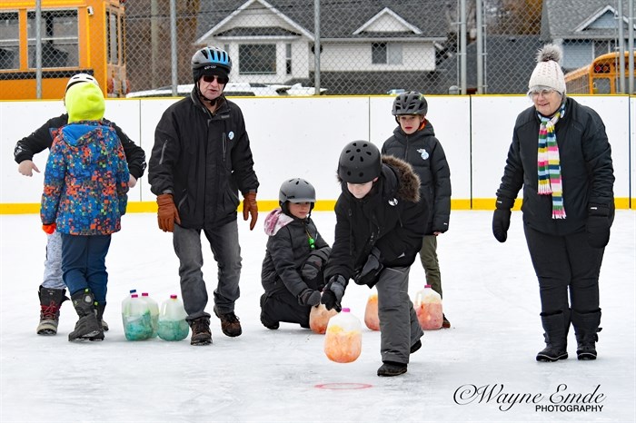 Jam can curling, albeit with frozen milk jugs at the Vernon Winter Carnival.