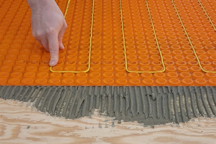Arden Tile installing Cosy Floor