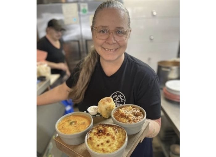 Owner at Little Hobo Soup and Sandwich Shop, Crystal Dugan holds a soup flight with lasagna soup, French onion soup and Doukhobor borscht.