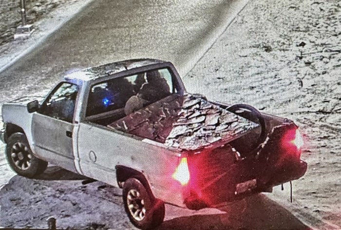 Surveillance footage shows the art piece in the back of a pickup truck around 10:30 p.m.