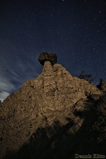 This photo shows a clear sky full of stars behind Coyote Rock near Kamloops. 