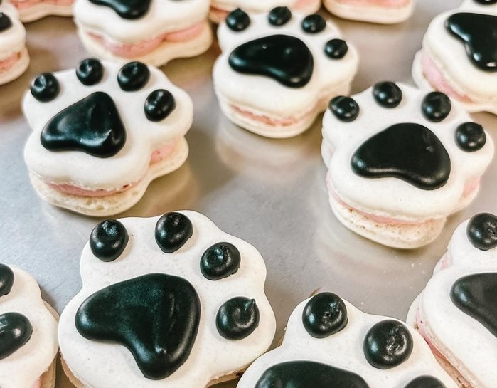 These strawberry chocolate paw shaped macarons were made by Mary Ann
