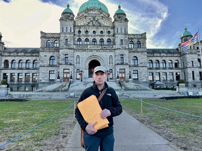 Jim Cooperman delivers his petition to the legislature in Victoria on Feb. 12, 2024.