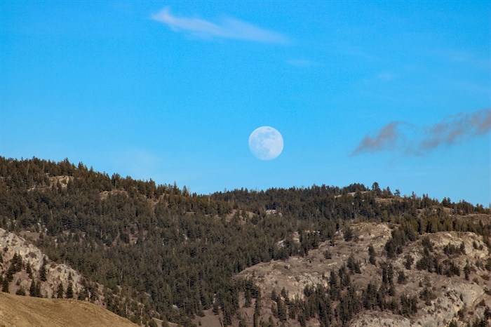 The full Snow moon pictured at dusk before the clouds rolled in over Kamloops. 