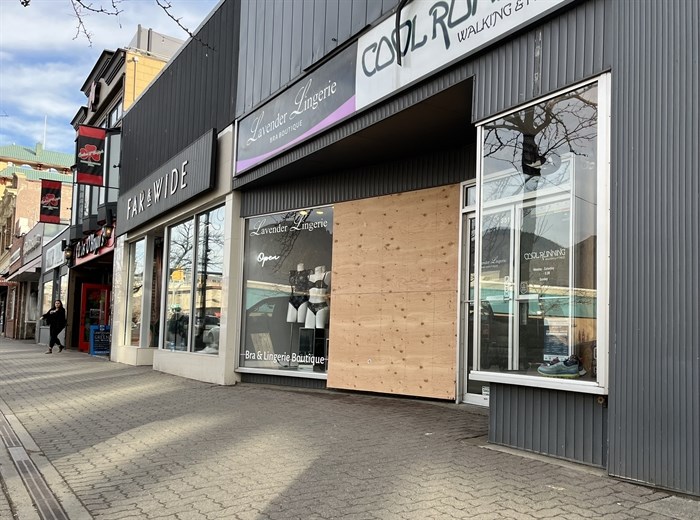The front window of Lavender Lingerie on Victoria Street in Kamloops' downtown core is boarded up after a theft in February. 