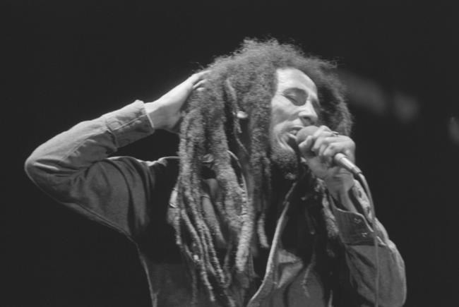 FILE - Jamaican Reggae singer Bob Marley performs in front of an audience of 40,000 during a festival concert of Reggae in Paris, France, July 4, 1980. The biopic “Bob Marley: One Love” has been a box office hit in the United States and several other countries. The film, starring Kingsley Ben-Adir, is focused on the Rastafari legend’s story during the making of his 1977 album “Exodus” while leading up to his impactful concert in his native Jamaica.