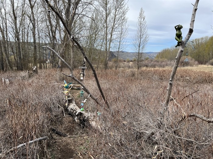 An area off Rivers Trail in Kamloops is decorated with windchimes and figurines. 