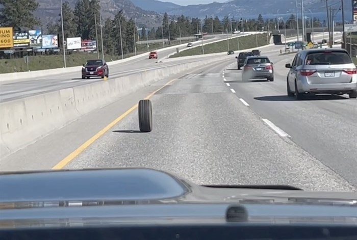 A screenshot of Marshall Jones' video of the loose tire rolling down the highway.