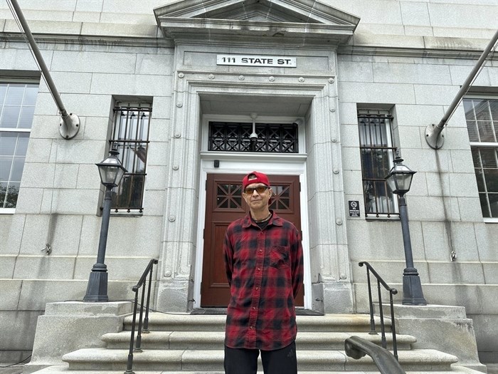 Ivo Skoric stands outside the Vermont Supreme Court building in Montpelier, Vt., Wednesday, May 29, 2024, after justices heard his appeal. Skoric, 59, representing himself, argued that he should not be denied unemployment benefits after he said he was fired from his job for misconduct after a random drug test showed he used medical marijuana off-duty.