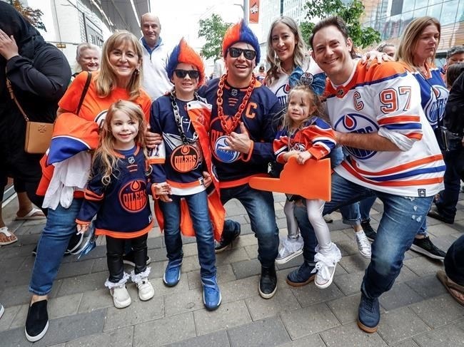 Edmonton Oilers fans arrive for Game 6 of the Western Conference finals of the NHL hockey Stanley Cup playoffs against the Dallas Stars in Edmonton, Sunday, June 2, 2024.