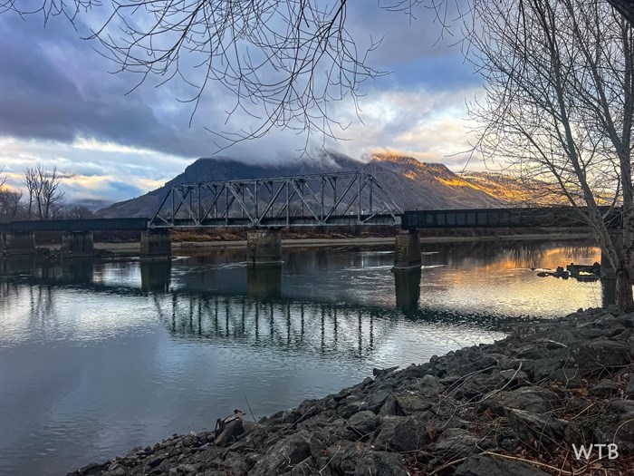 The rail bridge over the South Thompson River is pictured at dawn in Kamloops. 