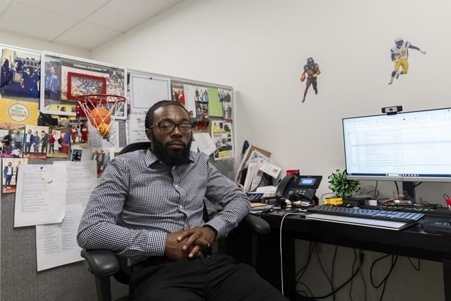 Shiloh Jordan, a Baltimore native whose cannabis conviction was pardoned by an executive order from Maryland Gov. Wes Moore on Monday, poses for a portrait in his office at the Center for Urban Families in Baltimore, Tuesday, June 18, 2024.