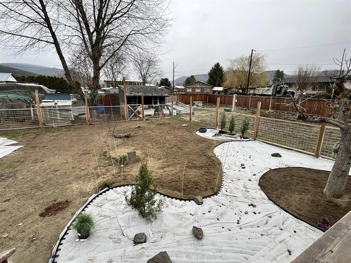 Fabric has been laid down on in a yard in Heffley Creek. 