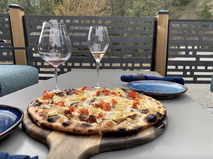 Delicious pizza and wine on the patio