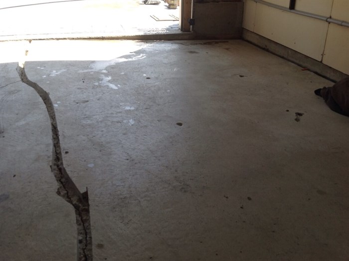 Cracked garage floor before service
