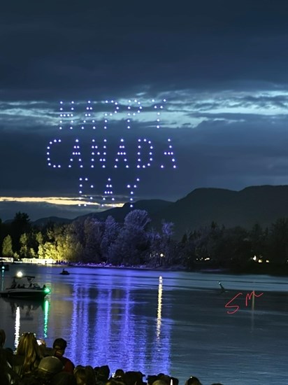 Lights from the first Canada Day drone show reflect in Thompson River in Kamloops. 