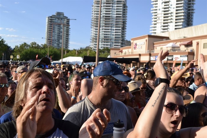 Rock 'n' roll fans cheering for 54-40 at Rock the Lake on July 14, 2024. 