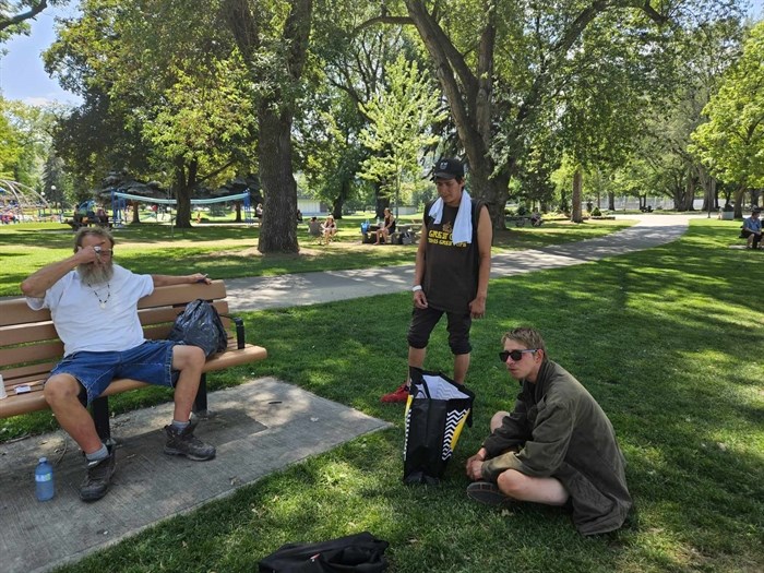Three homeless men in Kamloops cool off in the shade at Riverside Park. From left to right: Kevin-11, Simon Says, Josh Wonderboy.