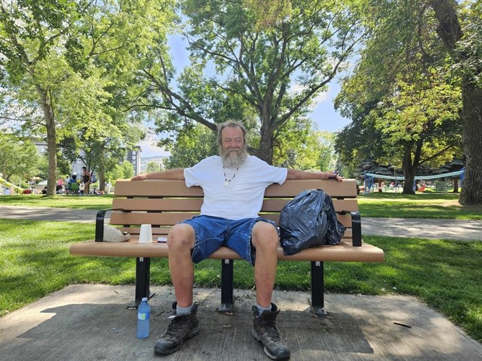 Homeless man Kevin -11 stays cool in the shade at Riverside Park in downtown Kamloops.
