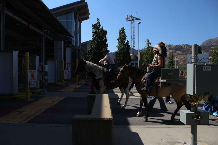 The group of riders cross into the U.S. from Canada at the Osoyoos-Oroville border in syilx Okanagan homelands on July 20, 2024. Photo by 

