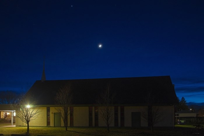 The moon and Venus can be seen above the Lutheran Church in Rutland.