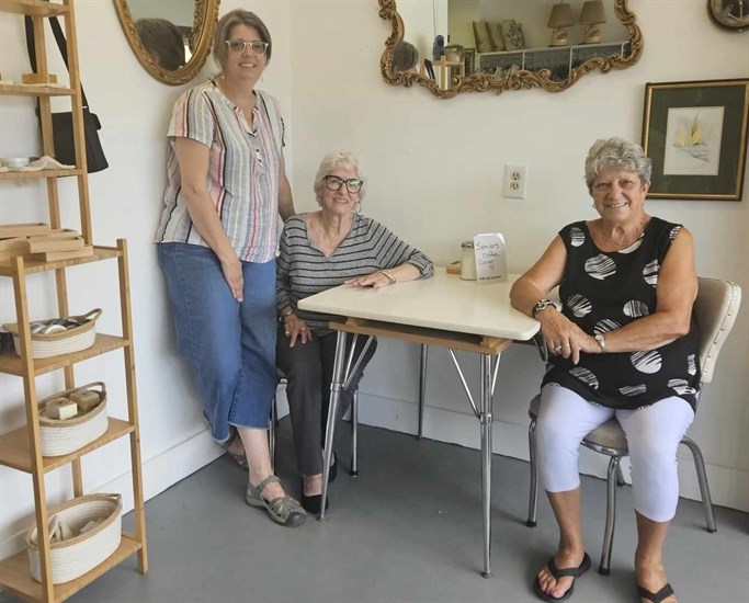 Owner at Old Friends Vintage & Thrift Caroline King (left) stands beside senior volunteers Katharine Johnson and Raffelina Johnson. 