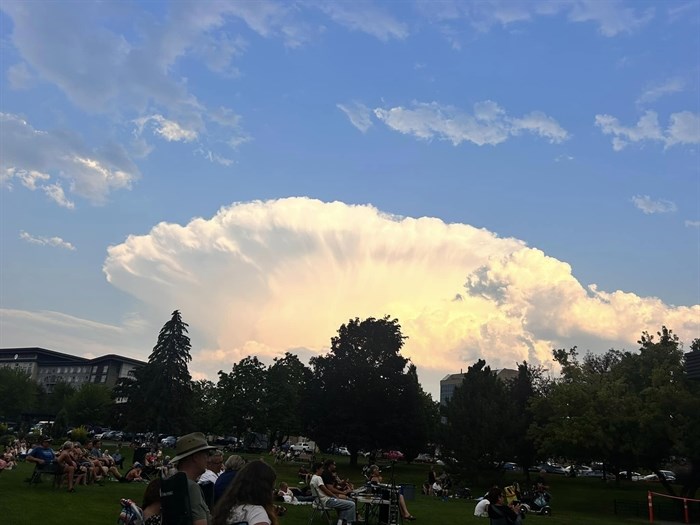 A strange looking cloud fans out in the sky about Riverside Park in Kamloops.