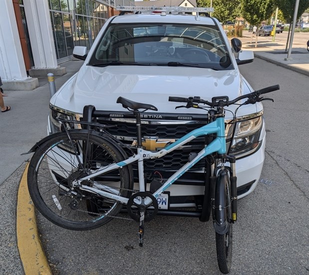 A photo of a bike attached to the front of a police car included with the bike theft analysis on Aug. 9, 2024