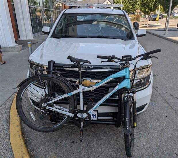 A photo of a bike attached to the front of a police car included with the bike theft analysis on Aug. 9, 2024 