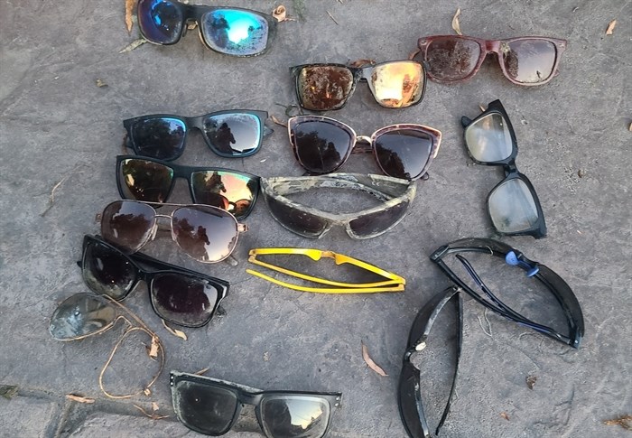 Many pairs of sunglasses were retrieved by a scuba diver by Osoyoos Lake. 