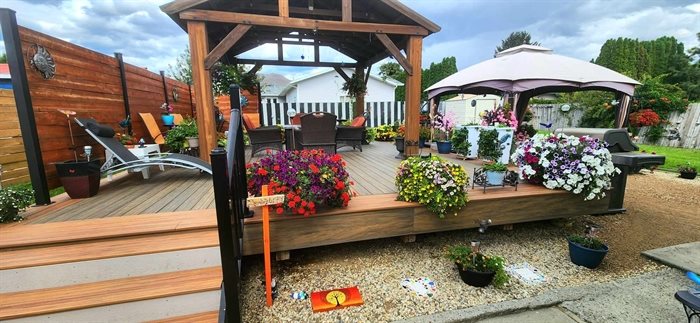 Kamloops resident Sharon Senger adding stepping stones, painted rocks and cute signs to her backyard oasis. 