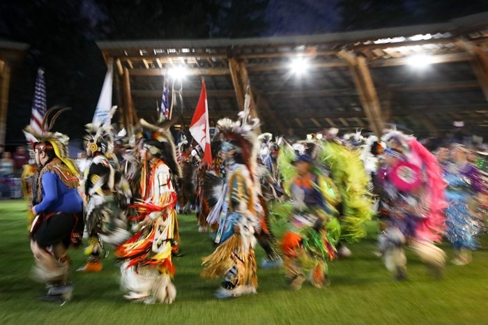 
Dancers participate in the grand entry for the 2024 Similkameen Powwow of Champions during its opening night on Aug. 30, 2024.